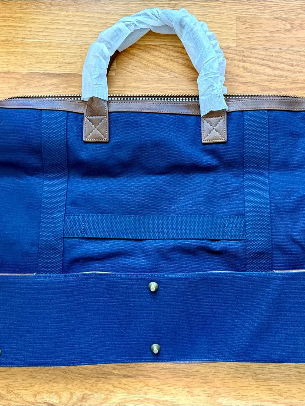 n Navy Duffel with Brown Trim in and White VRBO Logo